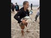 North Country Road Middle School science club students bring Peachy Keen down to the shoreline in preparation for his release back into the ocean following his rehabilitation