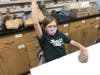 A 4th grade Connolly student gets hands-on experience with pottery using traditional Native American methods and using natural clay from the museum preserve.