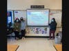 Eighth grade students Mason Foster, Carolyne Datkhayeva, Naomi Verrier, Kalia Edwards in Amanda Corazza’s class present their project on “Inequality, The Glass Ceiling and Job Status.” 