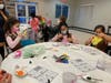 Girl Scouts celebrating World Thinking Day at the Juliette Low Friendship Center. 