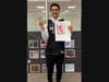 Newfield High School logo contest winner Daniel Savage with his winning design