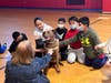 Connolly Elementary School students with Maddie, a therapy dog that meets with students twice a month to help reduce stress. 