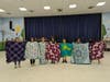 Members of the Girl Scouts of Suffolk County Troops 175 and 881 making blankets to support Girl Scout affiliates in Ukraine. 