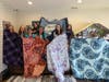 Members of the Girl Scouts of Suffolk County Troops 175 and 881 making blankets to support Girl Scout affiliates in Ukraine. 