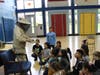 Mr. Grella put on his beekeeper uniform and explained what he does as a beekeeper. 