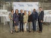 Photo-op next to renderings of the emergency department.