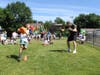 Tom Graham, of the Long Island Rough Riders, led Gribbin Elementary School students through a challenge in which they had to balance a bean bag on a paddle. 