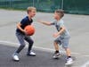 James Rant got ready to shoot a basket, while Jack Fugazy tried blocking him. 