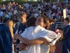 One student embraced her loved one with her diploma in hand. 