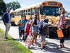Connolly Elementary School staff greeted students as they got off their buses for the first day of school in the Glen Cove School District on September 1. 