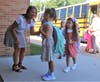 Students radiated enthusiasm as they greeted their principals and found their way to their new classrooms. 