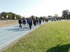 Lawrence Middle School students walking a mile around their track to honor the lives lost on September 11, 2001

