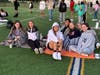 Riverhead High School seniors sitting together to watch the sunrise