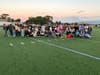 Riverhead High School’s senior class gathers on the football field to watch the sunrise together