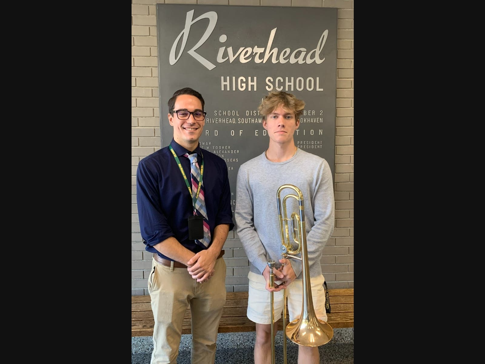 From left, Riverhead High School Band Director Joseph Randazzo and NYSSMA All-State bass trombone player Bryan Enos