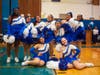 The Riverhead High School kickline gets ready to perform