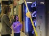 Third-grade student Hazel Kamath and LADSBS Assistant Principal Nicole Farley marvel at the school’s new book vending machine. 