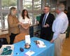 Kim Dragoo, Liberty Senior Manager, Energy Efficiency, East Region and Shannen McDonald, Program Manager, Water Efficiency, speak with Town of Hempstead Supervisor Don Clavin on water conservation seen by using AMI and EyeOnWater