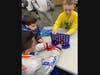 Lawrence young learners playing Connect Four
