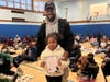 Grand Avenue Elementary School scholars attend a Read and Eat Dessert with Dad event with their father figures