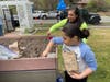 Students planted produce in the Comsewogue Community Garden. 