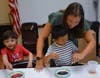 Through one STEAM activity, students experimented with the color wheel by mixing drops of different colored dyes into a bowl of milk and soap and creating new colors.    