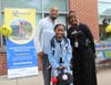 Principal Barbara Solomon greeted a father and daughter at the event. 
