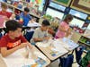 Fourth graders at Babylon Memorial Grade School took part in the index card tower challenge as part of a series of STEAM activities introducing the scientific method.