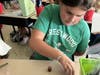 Another activity included one in which students were tasked with stacking pennies using only one hand within a one-minute time limit. 