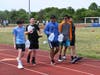 The POBMS community holds an annual walkathon to support well drilling projects in South Sudan during which students and staff walk carrying a gallon of water to symbolize the daily ordeals South Sudanese go through to obtain drinking water.