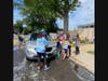 Students worked together with their families to wash cars for Valley Stream residents.