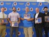 The Comsewogue School District recently inducted six alumni into its Hall of Fame. Pictured from left are inductees Joseph Droge, Keith Vigorito, John Swenning, Nick Azzara and Roy Lenzo Jr. Not pictured is inductee Al Kohart. 