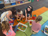Students use Legos to build creations.
