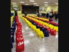Volunteers with the Port Jefferson Lions Club were at Clinton Avenue Elementary School filling bags with groceries to deliver to those in need throughout the community.