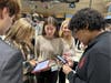 The students discussed their virtual businesses and cut various business deals in a simulated setting. 