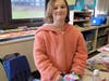The student picked out headlines, graphics and other parts of a news article.