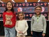 Babylon Elementary School students Kaiyah Tacahashi, Juliette Roades and Leo Margolis led the latest Board of Education Meeting in the Pledge of Allegiance.  