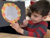 The students tested the projectors out using a flashlight. 