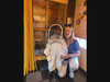 Maureen Early and participant in the bee hive with a beekeeper suit on 
