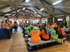Backpack pirate kids and volunteers waiting for lunch provided by Reworld™