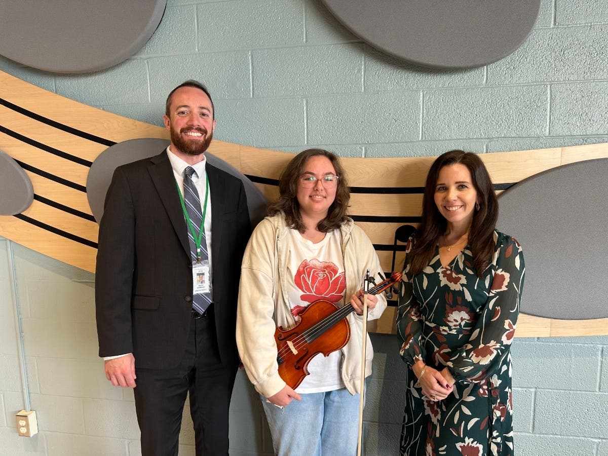 Julia Chu, center, with Dr. Robert Lombardo, Director of Fine and Performing Arts, and Julia’s teacher, Kristin Lombardo. 