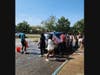  Lawrence High School seniors washing cars at their fundraiser
