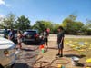  Lawrence High School seniors washing cars at their fundraiser

