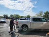  Lawrence High School seniors washing cars at their fundraiser
