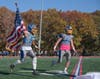 The Comsewogue Varsity Football team raced onto the field for the start of its Homecoming game. 