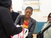 Nassau County Legislator Siela A. Bynoe gives a Thanksgiving turkey to a community member