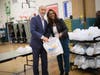 From left, Westbury School District Board of Education President and Town of North Hempstead Councilman Robert Troiano, Jr. and Westbury School District Superintendent Dr. Tahira A. DuPree Chase package turkeys to be distributed