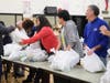 Dedicated volunteers distribute turkeys to Westbury and New Cassel community members