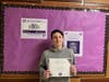 Anthony Allegrezza with his Service Above Self Award, which he earned for his commitment to helping local veterans.