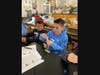 Sunrise Drive STRETCH students working on their DNA necklaces at Sayville High School.